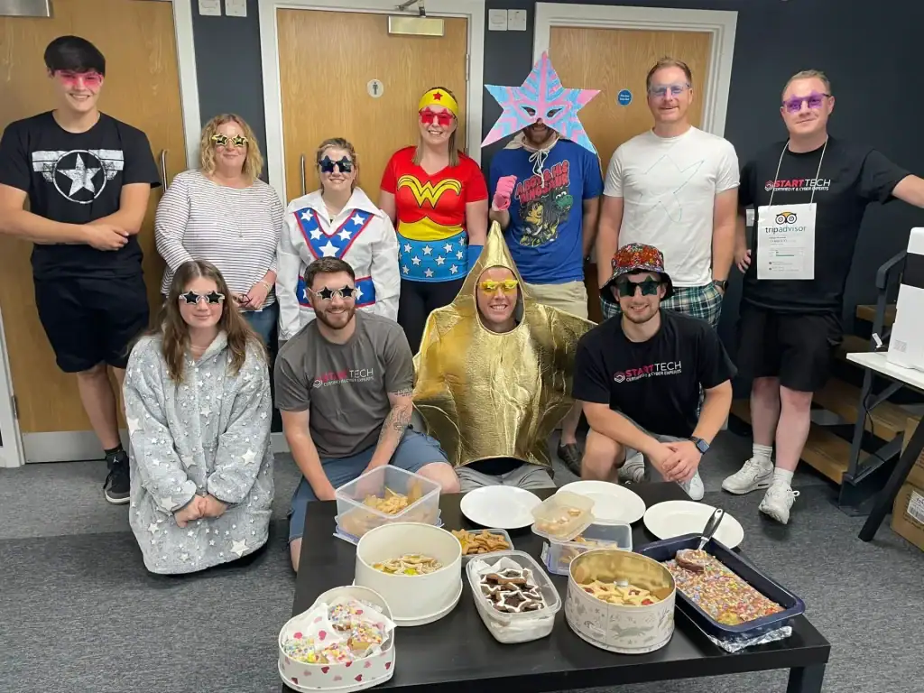 People wearing superhero and star-themed costumes at Little Stars.