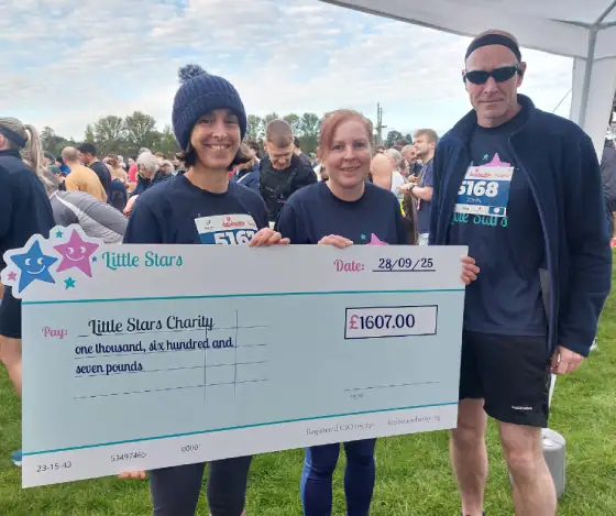 Runners with large charity check for 1607 pounds