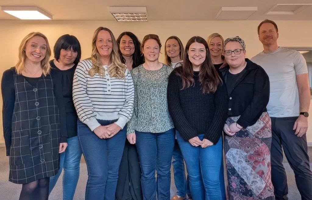 Diverse team of professionals at Little Stars childcare centre in the UK.