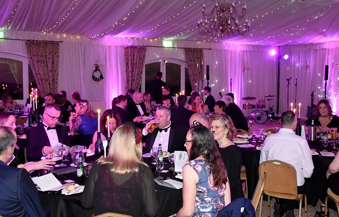 Elegant dinner event with guests enjoying a festive celebration.