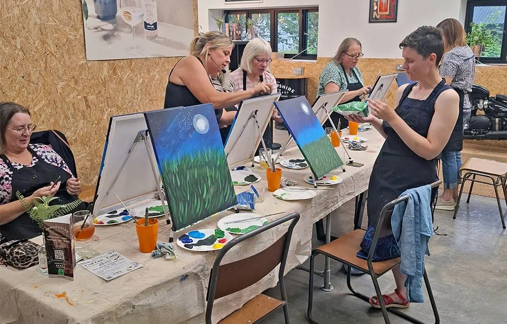 Bright children’s art workshop with colourful canvas paintings.