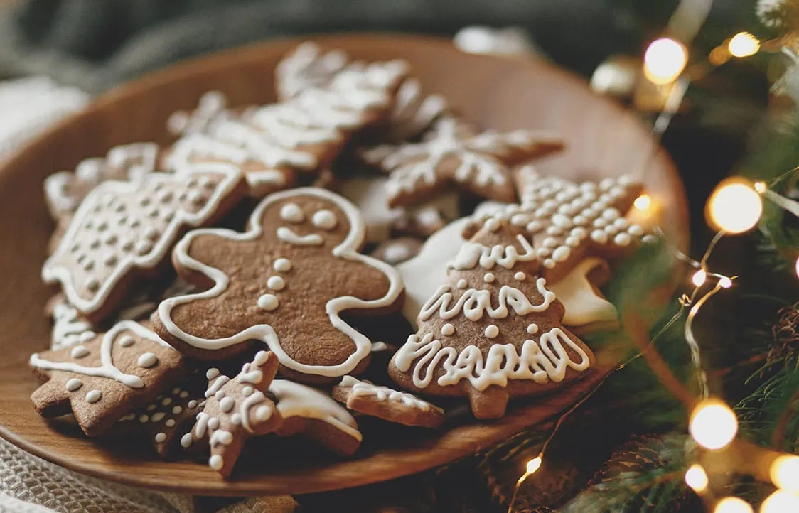 Festive Christmas gingerbread cookies decorated with icing, perfect for holiday celebrations and family gatherings.
