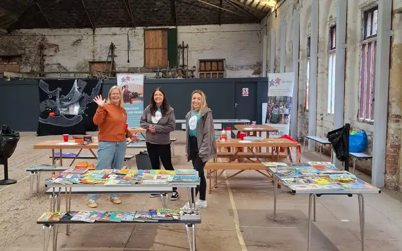 Hannah and Leanne from Little Stars with Clare from Lovely Land waving and smiling